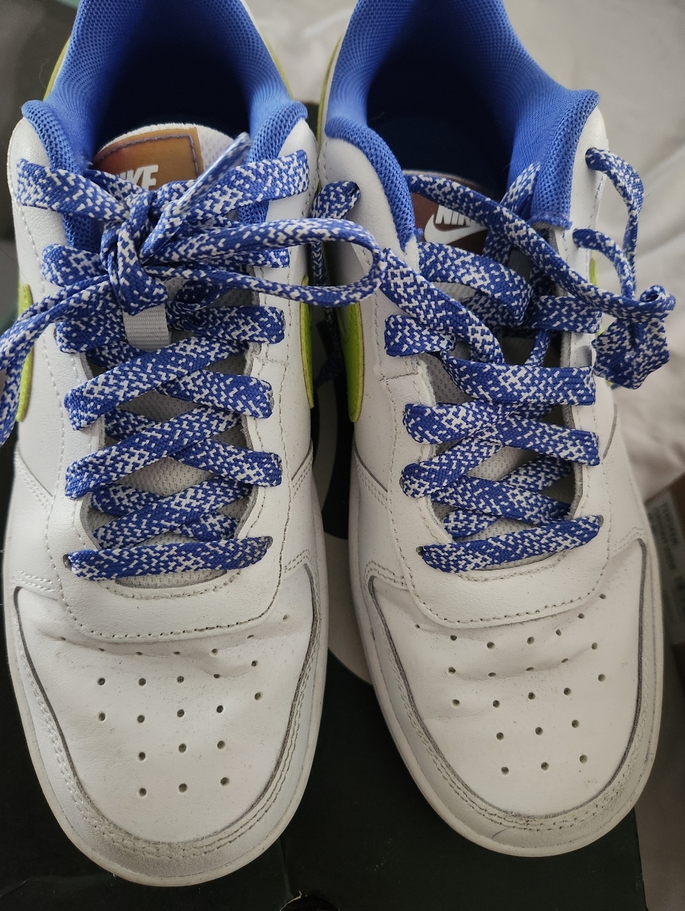 Nike Kids White Sneakers with Blue Laces and Neon Green Swoosh